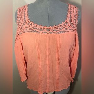 Maurice’s size XL peachy orange shirt with arm cut outs.
